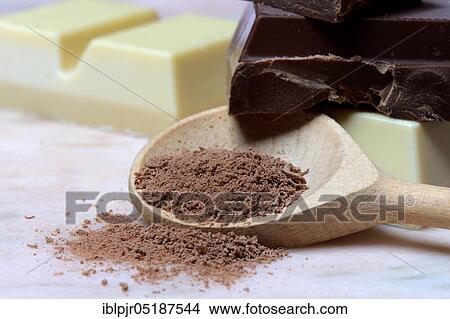 Grated chocolate blocks in cooking spoon, chocolate View Large Photo Image Picture - Grated chocolate blocks in cooking spoon, chocolate. Fotosearch