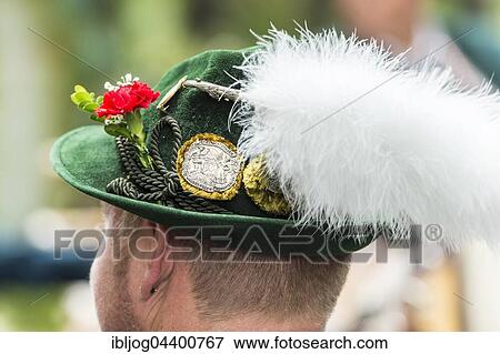 Green hat, white plume, badges, men's costume, Oktoberfest, Munich, Upper Bavaria, Bavaria, Germany, Europe View Large Photo Image Stock Photo - Green hat, white plume, badges, men's costume, Oktoberfest, Munich, Upper Bavaria, Bavaria, Germany, Europe. Fotosearch