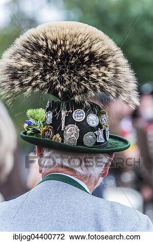 Stock Image - Green hat with brim, large Gamsbart, badges, gray costume jacket, men's costume, Oktoberfest, Munich, Upper Bavaria, Bavaria, Germany, Europe. Fotosearch