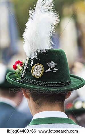Stock Photograph - Green hat with brim, plume, badges, green traditional jacket, men's costume, Oktoberfest, Munich, Upper Bavaria, Bavaria, Germany, Europe. Fotosearch
