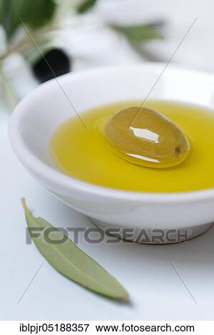 Green olive in shell with olive oil, Olea spec., Chalkidiki olives, Greece, Europe View Large Photo Image Stock Photo - Green olive in shell with olive oil, Olea spec., Chalkidiki olives, Greece, Europe. Fotosearch