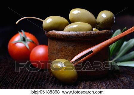 Stock Photo - Green olives in clay dish, Olea spec., Chalkidiki olives, Greece, Europe. Fotosearch
