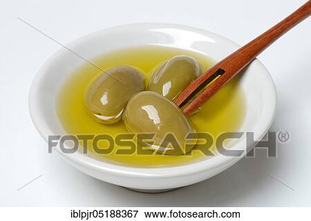 Green olives in shell with olive oil, Olea spec., Chalkidiki olives, Greece, Europe View Large Photo Image Stock Photo - Green olives in shell with olive oil, Olea spec., Chalkidiki olives, Greece, Europe. Fotosearch