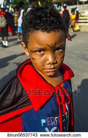 Grim looking boy, Carneval in the town of Sao Tome, Sao Tome and Principe, Atlantic ocean, Africa View Large Photo Image Stock Image - Grim looking boy, Carneval in the town of Sao Tome, Sao Tome and Principe, Atlantic ocean, Africa. Fotosearch