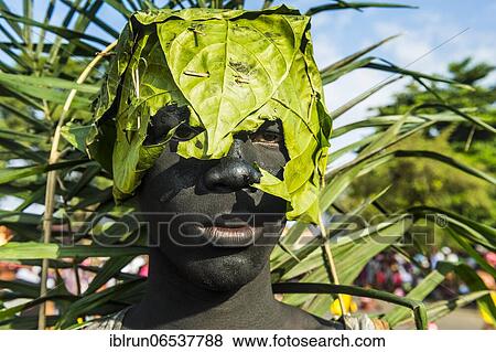Grim looking man with a banana leaf over his head, Carneval in the town of Sao Tome, Sao Tome and Principe, Atlantic ocean, Africa View Large Photo Image Stock Photo - Grim looking man with a banana leaf over his head, Carneval in the town of Sao Tome, Sao Tome and Principe, Atlantic ocean, Africa. Fotosearch