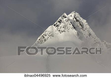 Grossglockner summit with clouds, High Tauern National Park, Carinthia, Austria, Europe View Large Photo Image Stock Photography - Grossglockner summit with clouds, High Tauern National Park, Carinthia, Austria, Europe. Fotosearch
