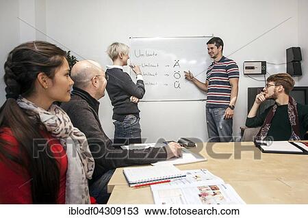 Group of adult students with a teacher, German course at a language school, Düsseldorf, North Rhine-Westphalia, Germany, Europe View Large Photo Image Stock Image - Group of adult students with a teacher, German course at a language school, Düsseldorf, North Rhine-Westphalia, Germany, Europe. Fotosearch