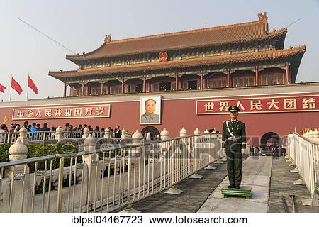 Stock Image - Guardsman in front of portrait of Mao Zedong, Gate of Heavenly Peace, Beijing, China, Asia. Fotosearch