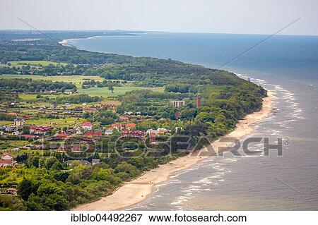 Stock Photo - Gąski with lighthouse, sandy beach, The Baltic Coast, West Pomerania Province, Poland, Europe. Fotosearch