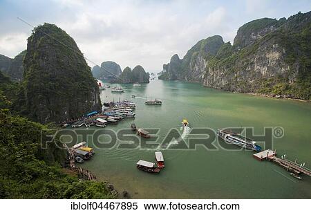 Halong Bay with boats, limestone cliffs, Gulf of Tonkin, Halong, North Vietnam, Vietnam, Asia View Large Photo Image Stock Photography - Halong Bay with boats, limestone cliffs, Gulf of Tonkin, Halong, North Vietnam, Vietnam, Asia. Fotosearch