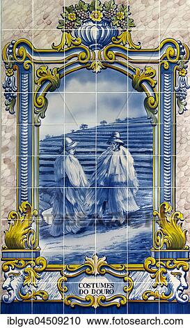 Stock Image - Hand-painted azulejo, ceramic tile with motif wine growers, wine region Alto Douro, Pinhao, Portugal, Europe. Fotosearch