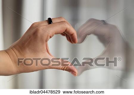 Stock Photo - Hand shaping heart. Fotosearch