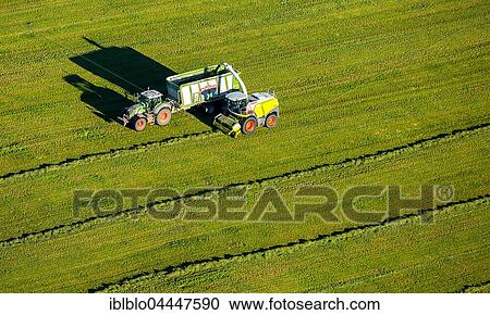 Hay harvest with mower and tractor with trailer, aerial view, Bad Fredeburg, Schmallenberg, Hochsauerlandkreis, North Rhine-Westphalia, Germany, Europe View Large Photo Image Stock Image - Hay harvest with mower and tractor with trailer, aerial view, Bad Fredeburg, Schmallenberg, Hochsauerlandkreis, North Rhine-Westphalia, Germany, Europe. Fotosearch