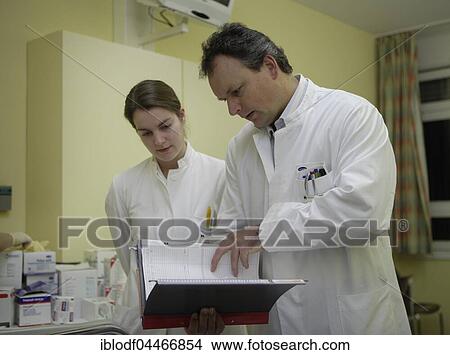 Head doctor and female doctor, doctor's visit in the Dominikus Hospital, Vascular Surgery Department, Düsseldorf, North Rhine-Westphalia, Germany, Europe View Large Photo Image Picture - Head doctor and female doctor, doctor's visit in the Dominikus Hospital, Vascular Surgery Department, Düsseldorf, North Rhine-Westphalia, Germany, Europe. Fotosearch