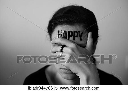 Head of a Woman with inscription Happy on the forehead, with hand over her eyes View Large Photo Image Stock Photography - Head of a Woman with inscription Happy on the forehead, with hand over her eyes. Fotosearch