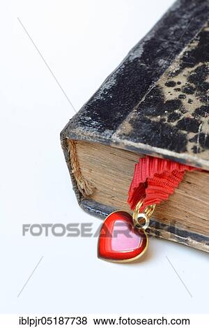 Heart on tape in old book View Large Photo Image Stock Photo - Heart on tape in old book. Fotosearch