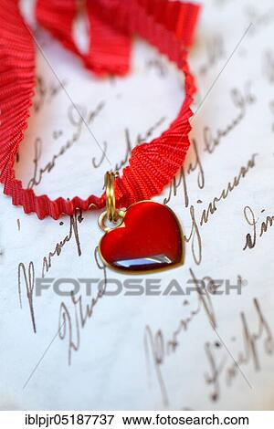 Heart on tape on old script View Large Photo Image Stock Photo - Heart on tape on old script. Fotosearch