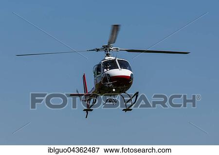 Helicopter EC 120B Colibri in the air, Pfaffnau, Lucerne, Switzerland, Europe View Large Photo Image Stock Photo - Helicopter EC 120B Colibri in the air, Pfaffnau, Lucerne, Switzerland, Europe. Fotosearch