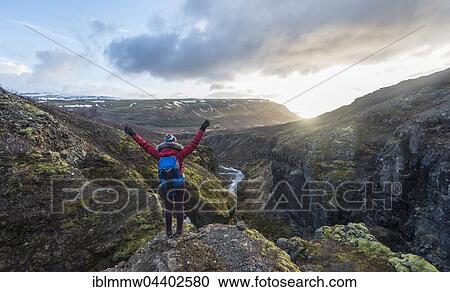 Stock Image - Hiker looking towards Canyon of Glymur, Hvalfjarðarsveit, Western Region, Iceland, Europe. Fotosearch