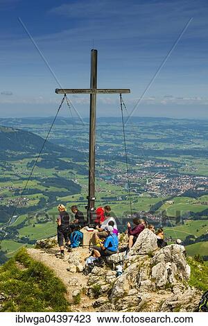 Stock Image - Hikers at the summit, view from Rubihorn, 1957m, Iller Valley, Allgäu, Bavaria, Germany, Europe. Fotosearch