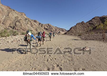 Hikers in dry riverbed, Fish River Canyon, Namibia, Africa View Large Photo Image Stock Image - Hikers in dry riverbed, Fish River Canyon, Namibia, Africa. Fotosearch