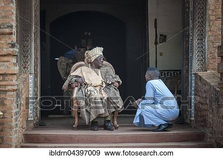His Majesty, El Hadj Ibrahim Mbombo Njoya Sultan, King of Bamoun, in front of the palace entrance, during a consultation with a tributary, Foumbam, West Region, Cameroon, Africa View Large Photo Image Stock Photo - His Majesty, El Hadj Ibrahim Mbombo Njoya Sultan, King of Bamoun, in front of the palace entrance, during a consultation with a tributary, Foumbam, West Region, Cameroon, Africa. Fotosearch