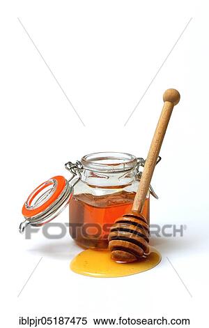 Stock Photography - Honey in jars and honey spoon, lime blossom honey. Fotosearch