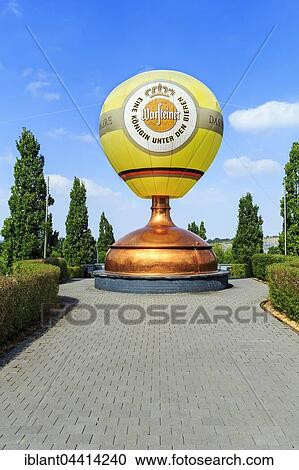 Hot air balloon on sculpture of a brewing kettle, Warsteiner Brewery Visitor Center, Warstein, Sauerland, North Rhine-Westphalia, Germany, Europe View Large Photo Image Stock Image - Hot air balloon on sculpture of a brewing kettle, Warsteiner Brewery Visitor Center, Warstein, Sauerland, North Rhine-Westphalia, Germany, Europe. Fotosearch