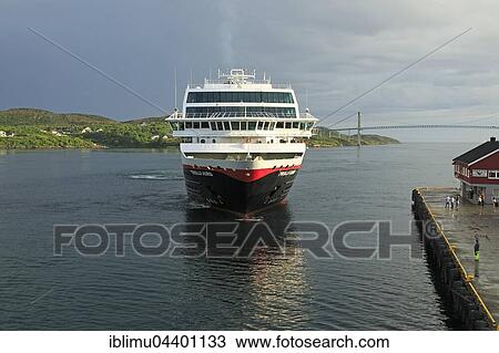 Stock Image - Hurtigruten ship Trollfjord arriving at port of Rorvik, Lofoten, Norway, Europe. Fotosearch