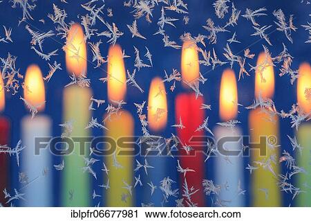 Ice flowers on glass pane in candlelight View Large Photo Image Stock Image - Ice flowers on glass pane in candlelight. Fotosearch