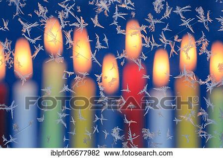 Ice flowers on glass pane in candlelight View Large Photo Image Stock Image - Ice flowers on glass pane in candlelight. Fotosearch