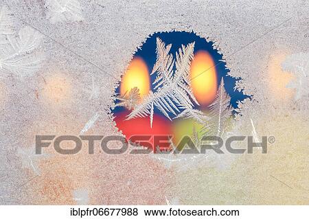 Ice flowers on glass pane in candlelight View Large Photo Image Stock Photo - Ice flowers on glass pane in candlelight. Fotosearch