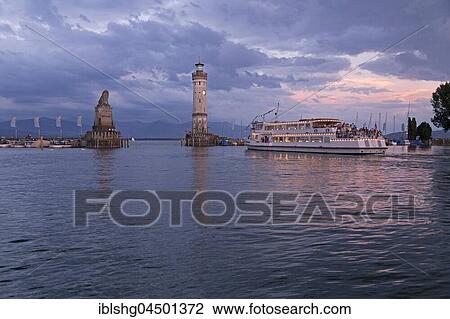 Illuminated excursion boat in the harbor with lighthouse, evening mood, Lindau, Lake Constance, Bavaria, Germany, Europe View Large Photo Image Stock Image - Illuminated excursion boat in the harbor with lighthouse, evening mood, Lindau, Lake Constance, Bavaria, Germany, Europe. Fotosearch