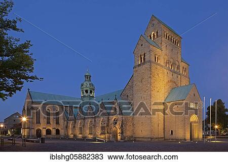 Stock Image - Illuminated high dome at dusk, Hildesheim, Lower Saxony, Germany, Europe. Fotosearch