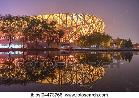 Stock Photograph - Illuminated National Stadium in the Olympic Park, dusk, Beijing, China, Asia. Fotosearch
