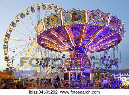 Illuminated swing carousel and Ferris wheel, Cranger Kirmes, the largest folk festival in the Ruhr district, Herne, North Rhine-Westphalia, Germany, Europe View Large Photo Image Stock Image - Illuminated swing carousel and Ferris wheel, Cranger Kirmes, the largest folk festival in the Ruhr district, Herne, North Rhine-Westphalia, Germany, Europe. Fotosearch