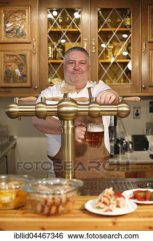 Innkeeper, waiter, dispensing beer, pub, beer pump, Karlovy Vary, Czech Republic, Europe View Large Photo Image Stock Photograph - Innkeeper, waiter, dispensing beer, pub, beer pump, Karlovy Vary, Czech Republic, Europe. Fotosearch