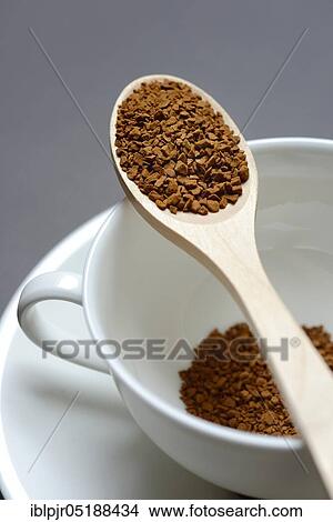 Instant coffee with wooden spoon and coffee cup, Coffea arabica View Large Photo Image Picture - Instant coffee with wooden spoon and coffee cup, Coffea arabica. Fotosearch