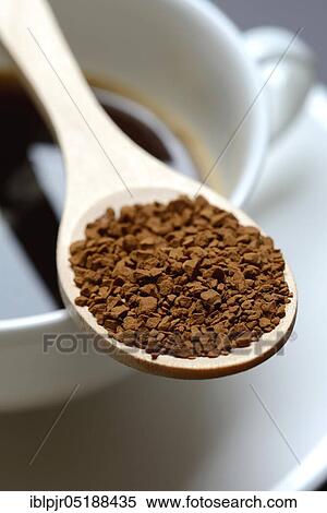 Instant coffee with wooden spoon and coffee cup, Coffea arabica View Large Photo Image Stock Photography - Instant coffee with wooden spoon and coffee cup, Coffea arabica. Fotosearch