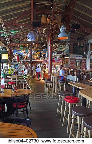 Interior of seafood restaurant Gosch, port of List, Sylt, North Frisian Islands, North Frisia, Schleswig-Holstein, Germany, Europe View Large Photo Image Stock Image - Interior of seafood restaurant Gosch, port of List, Sylt, North Frisian Islands, North Frisia, Schleswig-Holstein, Germany, Europe. Fotosearch