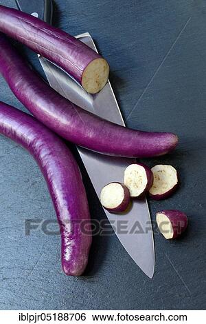 Japanese eggplant with knife, Solanum melongena, Solanum melongina View Large Photo Image Stock Photograph - Japanese eggplant with knife, Solanum melongena, Solanum melongina. Fotosearch