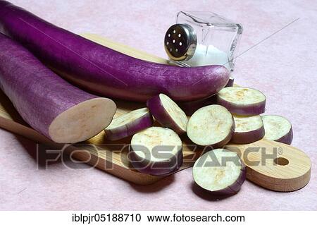 Japanese eggplants with salt shaker, Solanum melongena, Solanum melongina View Large Photo Image Stock Image - Japanese eggplants with salt shaker, Solanum melongena, Solanum melongina. Fotosearch