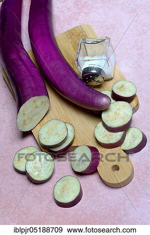 Japanese eggplants with salt shaker, Solanum melongena, Solanum melongina View Large Photo Image Stock Photo - Japanese eggplants with salt shaker, Solanum melongena, Solanum melongina. Fotosearch