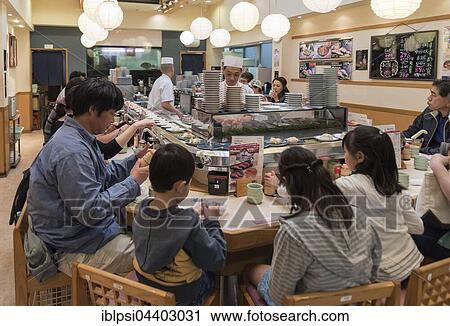 Kaiten-zushi restaurant serving sushi on rotating conveyor belt, Tsukiji fish market, Tokyo, Japan, Asia View Large Photo Image Stock Image - Kaiten-zushi restaurant serving sushi on rotating conveyor belt, Tsukiji fish market, Tokyo, Japan, Asia. Fotosearch