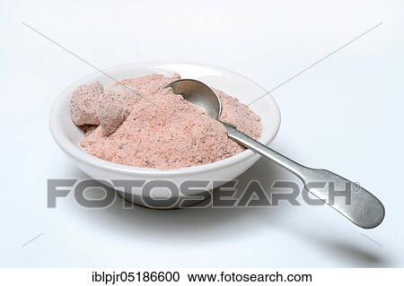 Stock Image - Kala Namak, ground salt with spoon in bowl, Indian salt, black salt, black salt, India, Asia. Fotosearch