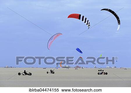 Stock Photography - Kite buggies on sandy beach, Sankt Peter-Ording, Schleswig-Holstein Wadden Sea National Park, North Frisia, Schleswig-Holstein, Germany, Europe. Fotosearch