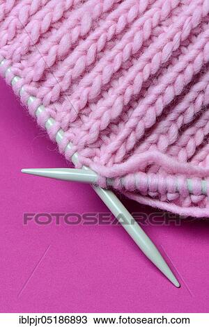Stock Image - Knitted wool with knitting needles, wool, felting wool, do-it-yourself, knitting. Fotosearch
