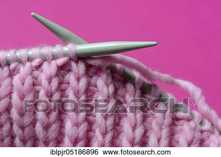 Knitted wool with knitting needles, wool, felting wool, do-it-yourself, knitting View Large Photo Image Stock Photograph - Knitted wool with knitting needles, wool, felting wool, do-it-yourself, knitting. Fotosearch