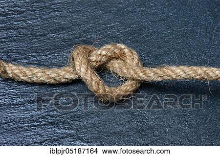 Picture - Knots in jute rope, intertwined, knotted. Fotosearch