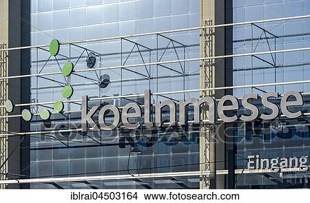 Picture - Koelnmesse logo on glass facade, Cologne fair, east entrance, Cologne, North Rhine-Westphalia, Germany, Europe. Fotosearch